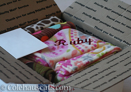 Huge box of personalized kitty blankies - © Colehauscats.com